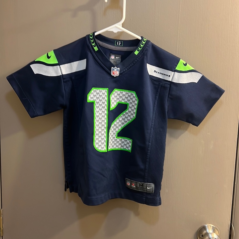 Seahawk official child’s medium jersey.